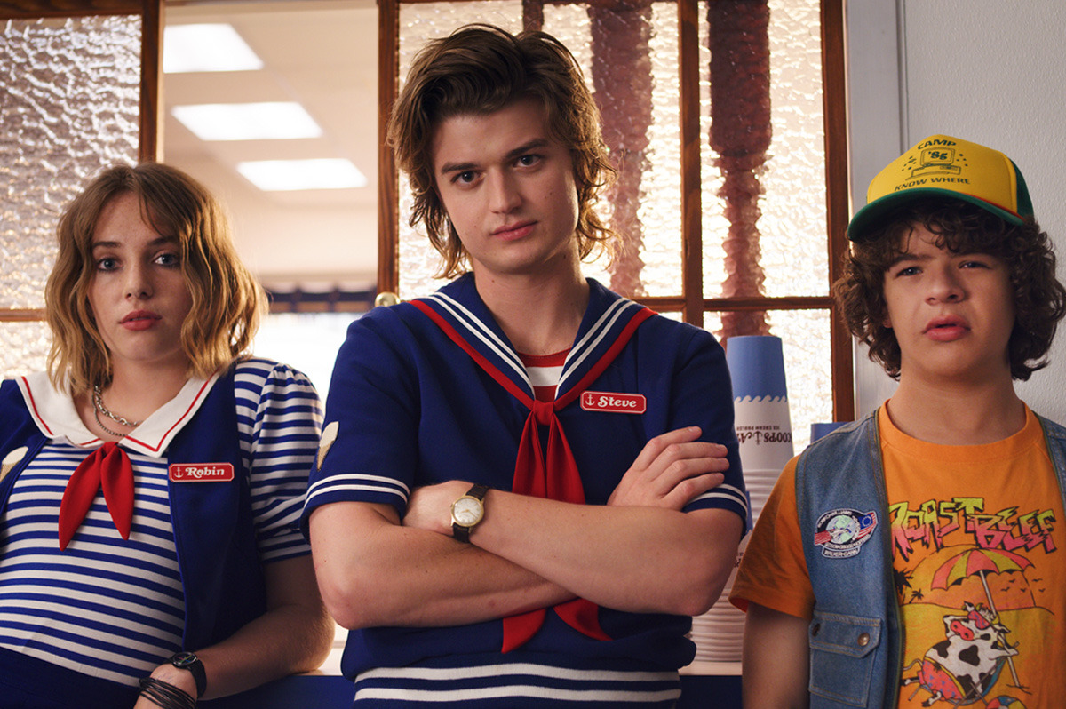  Three teens in ’80s outfits.