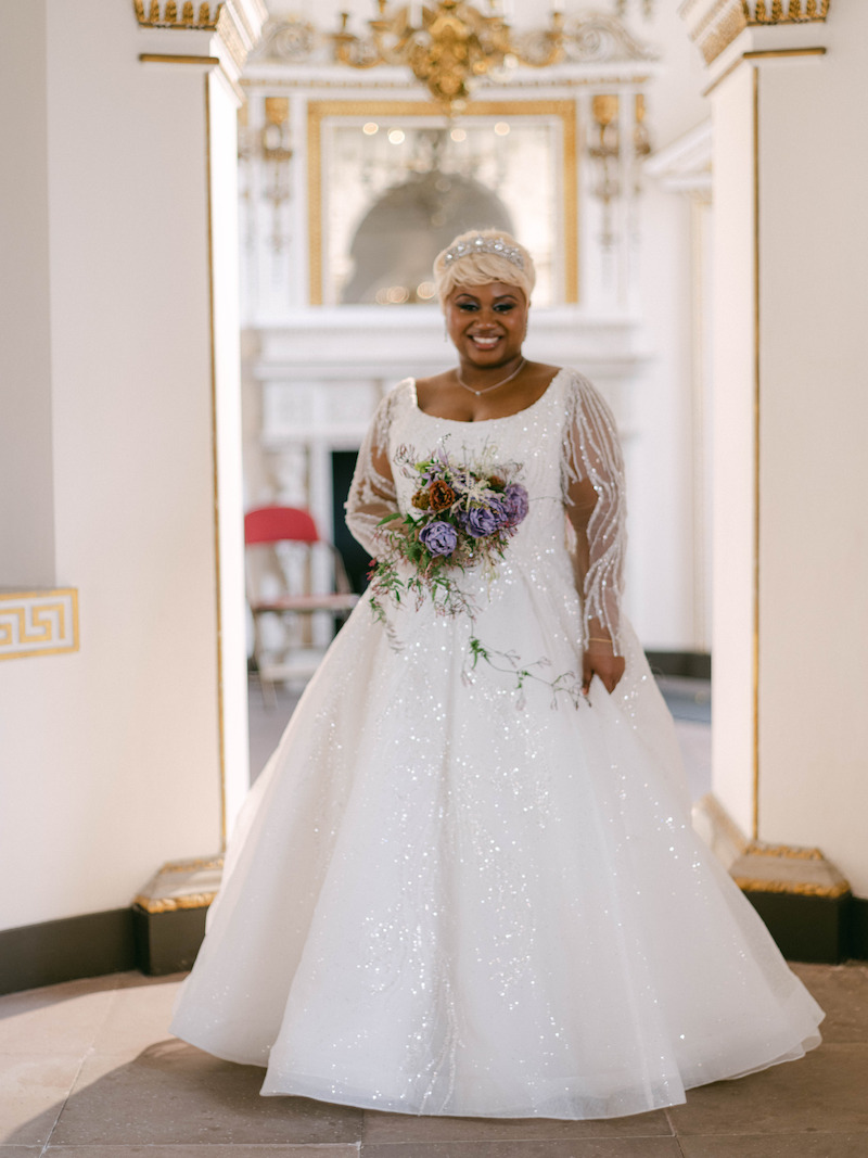 Tiffany Rae stands in her wedding gown in 'The Event of the Season: A Bridgerton Wedding'