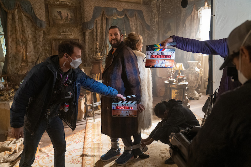 Adam Sandler as Nick Spitz, Jennifer Aniston as Audrey Spitz and Zurin Villanueva as Imani.