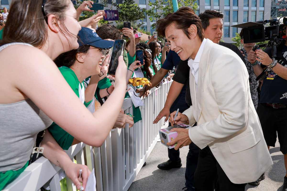 Lee Byung-hun greets fans during Netflix's ‘Squid Game’ Season 3 Fan Event in Brooklyn, New York.