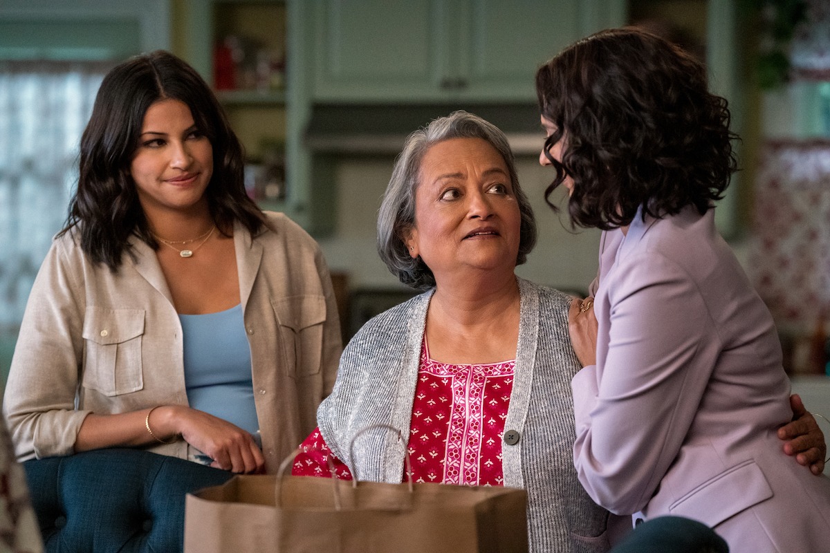Richa Moorjani as Kamala and Ranjita Chakravarty as Nirmala standing in the kitchen in ‘Never Have I Ever’ Season 4. 