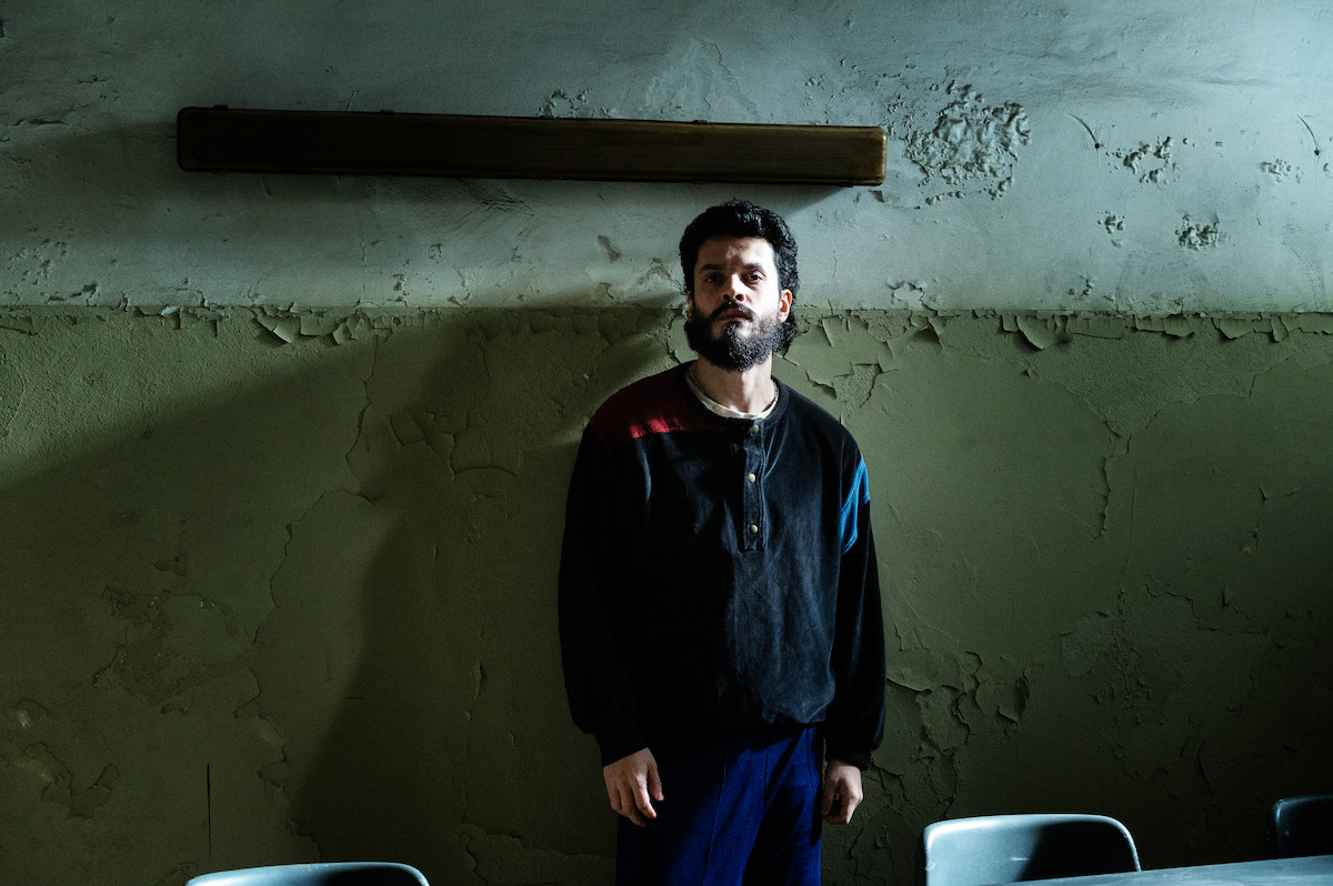 Giacomo Fadda as Francesco waiting in an interrogation room in ‘The Monster of Florence.’