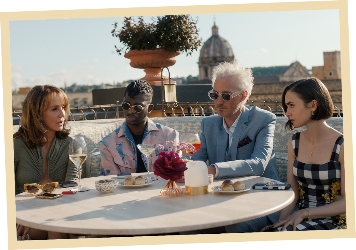 Philippine Leroy-Beaulieu as Sylvie Grateau, Samuel Arnold as Julien, Bruno Gouery as Luc and Lily Collins as Emily in ‘Emily in Paris’ Season 5.