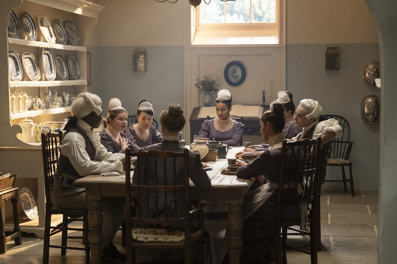 Gracie McGonigal as Hazel, Yerin Ha as Sophie Baek, and Oli Higginson as Footman John in Bridgerton Season 4.