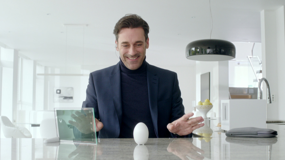 John Hamm smiles at an egg in Season 2 of 'Black Mirror'
