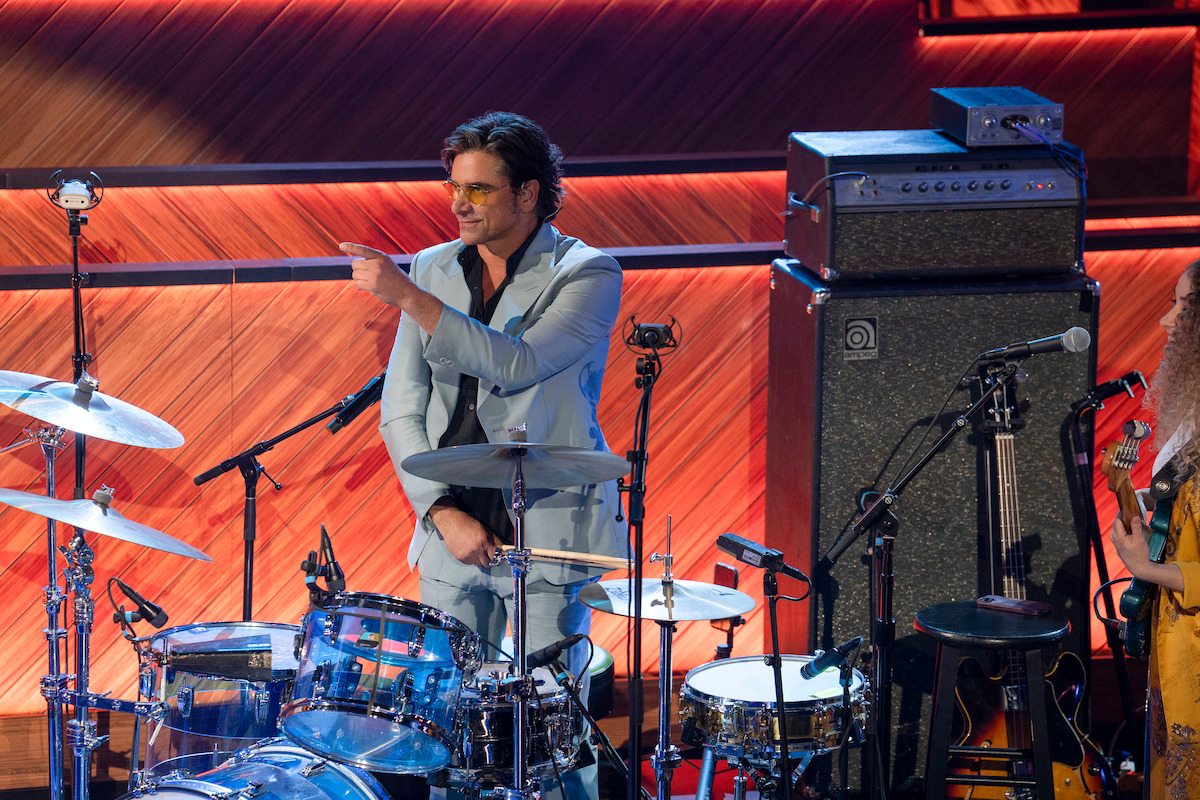 John Stamos sits behind a drum set at The Bellwether in Los Angeles.