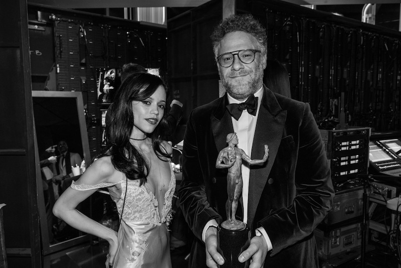 Jenna Ortega and Seth Rogen pose with the Actor Award.
