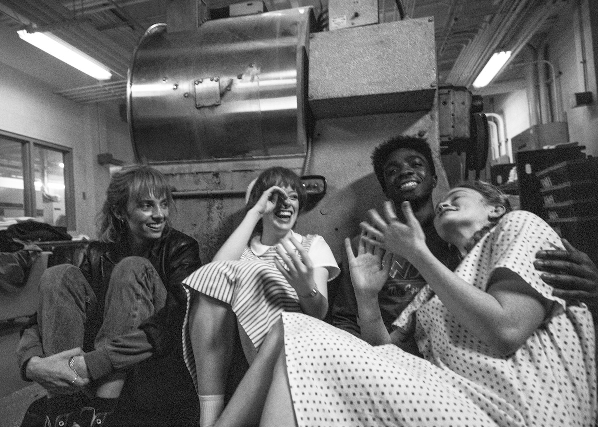 STRANGER THINGS: SEASON 5. (L to R) Maya Hawke, Amybeth McNulty, Caleb McLaughlin, and Sadie Sink behind the scenes of Stranger Things: Season 5.