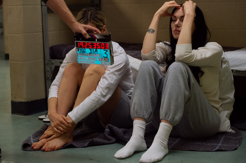 (L to R) Taylor Schilling as Piper, Laura Prepon as Alex on the set of Orange Is The New Black Season 4.