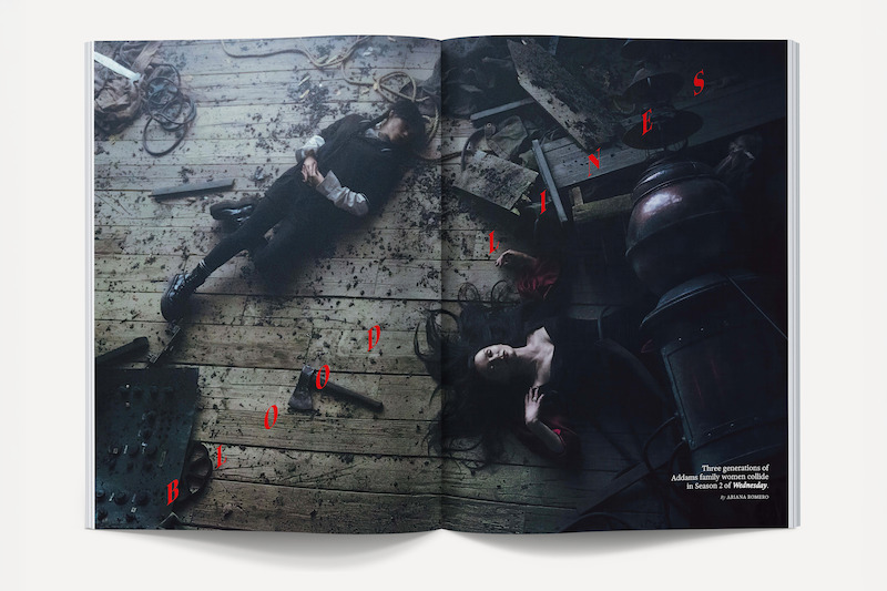 A man and woman lie on a wooden floor in a dim, rustic room scattered with tools and debris, dramatic lighting and shadows creating a mysterious, cinematic atmosphere.