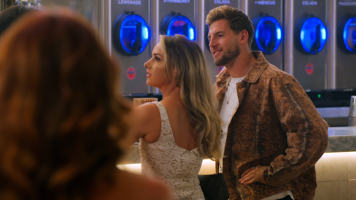 Sophie and Kieran sitting at a bar.