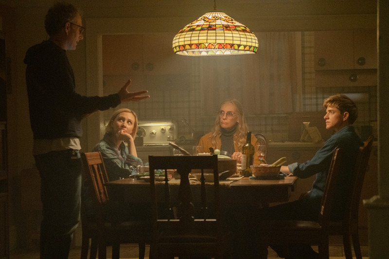 Director Euros Lyn, Sarah Gadon as Laura Redman, Toni Collette as Evelyn Wade, and Mae Martin as Alex Dempsey behind the scenes of 'Wayward.'