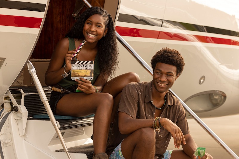 Carlacia Grant as Cleo and Jonathan Daviss as Pope in Outer Banks Season 3 Behind-the-Scenes Photo Gallery