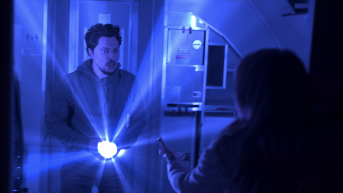 A man with a glowing object.