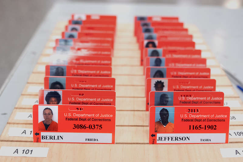 Stacks of orange prison ID cards in Season 6 of Orange Is the New Black. 