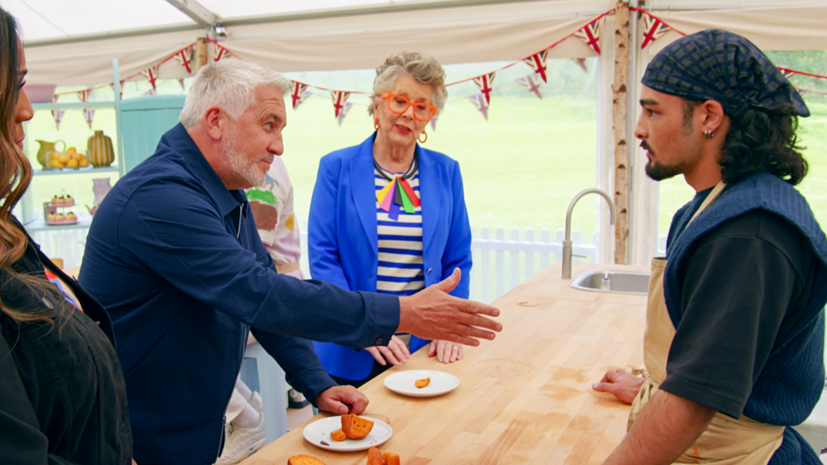 Paul extends his hand to Dylan.