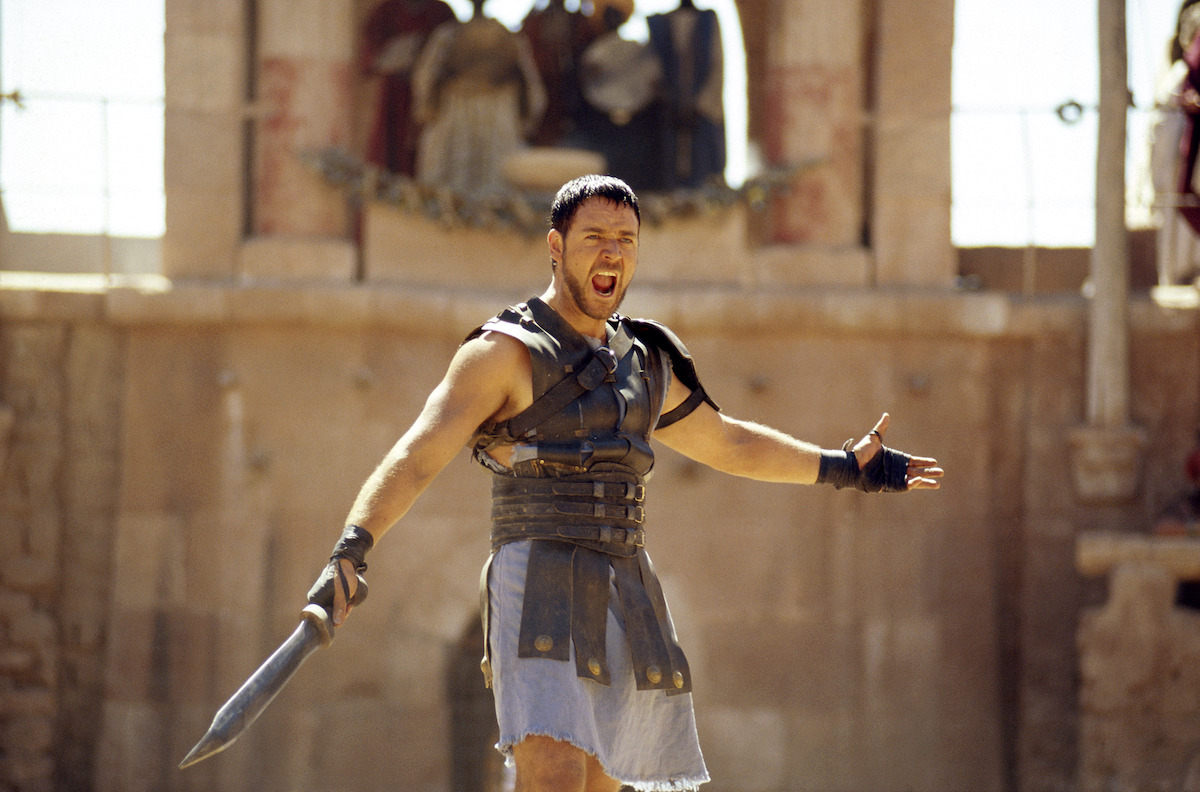 Russell Crowe as Maximus stands in an arena in ‘Gladiator.’