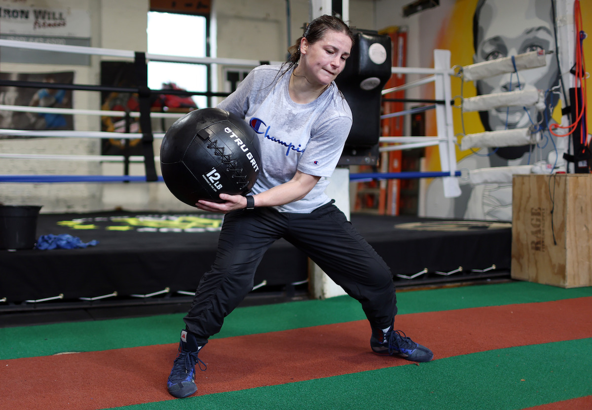 Katie Taylor trains with a medicine ball.