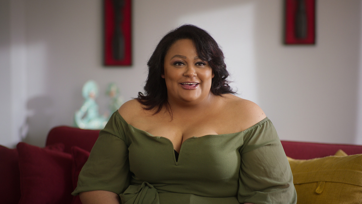 Nakysha in a green blouse. 