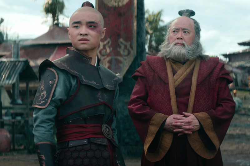 Dallas Liu as Prince Zuko and Paul Sun-Hyung Lee as Iroh wear fire nation clothing in season 1 of 'Avatar: The Last Airbender'