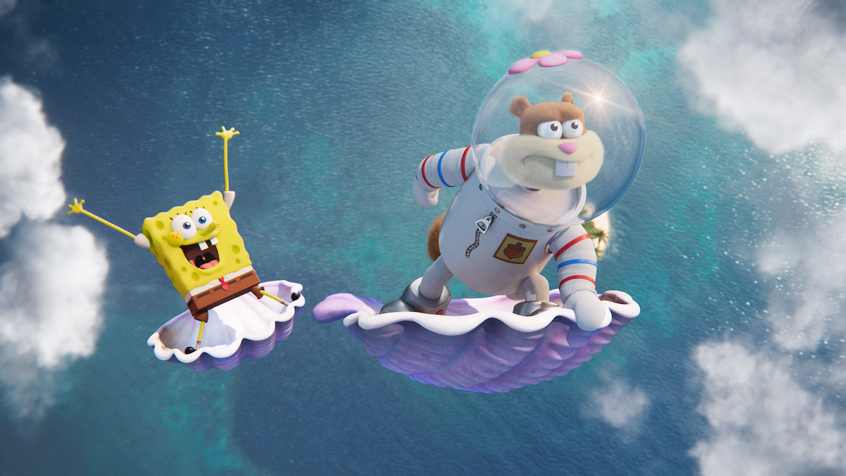 SpongeBob and Sandy Cheeks ride on giant flying shells through the sky and above the ocean in a still from ‘Saving Bikini Bottom: The Sandy Cheeks Movie.’