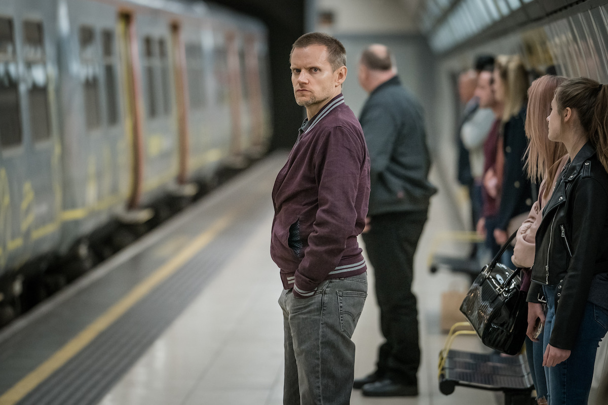 Man waits for train in the show ‘Safe.’