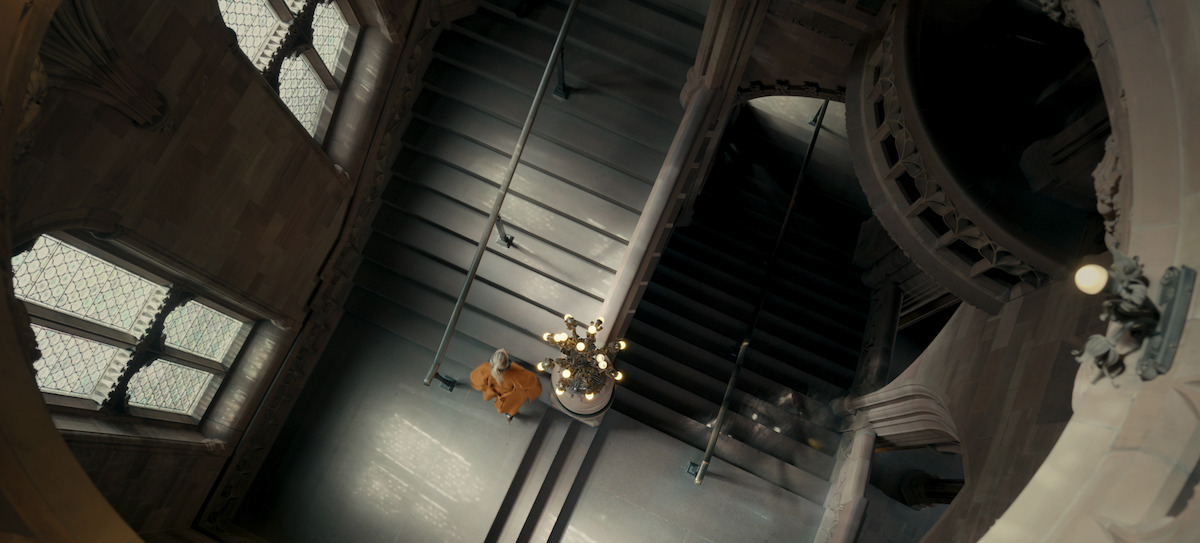 Sophie walks down the stairs of the Palace of Westminster