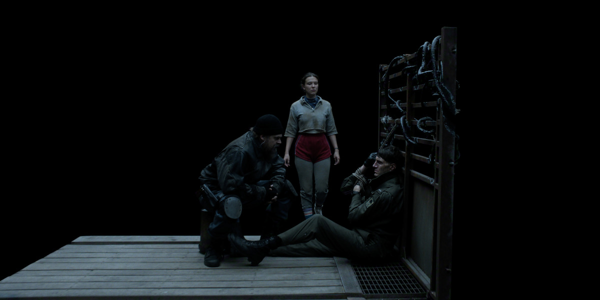 David Harbour as Jim Hopper, Millie Bobby Brown as Eleven, and Alex Breaux as Lt. Robert Akers in ‘Stranger Things 5’