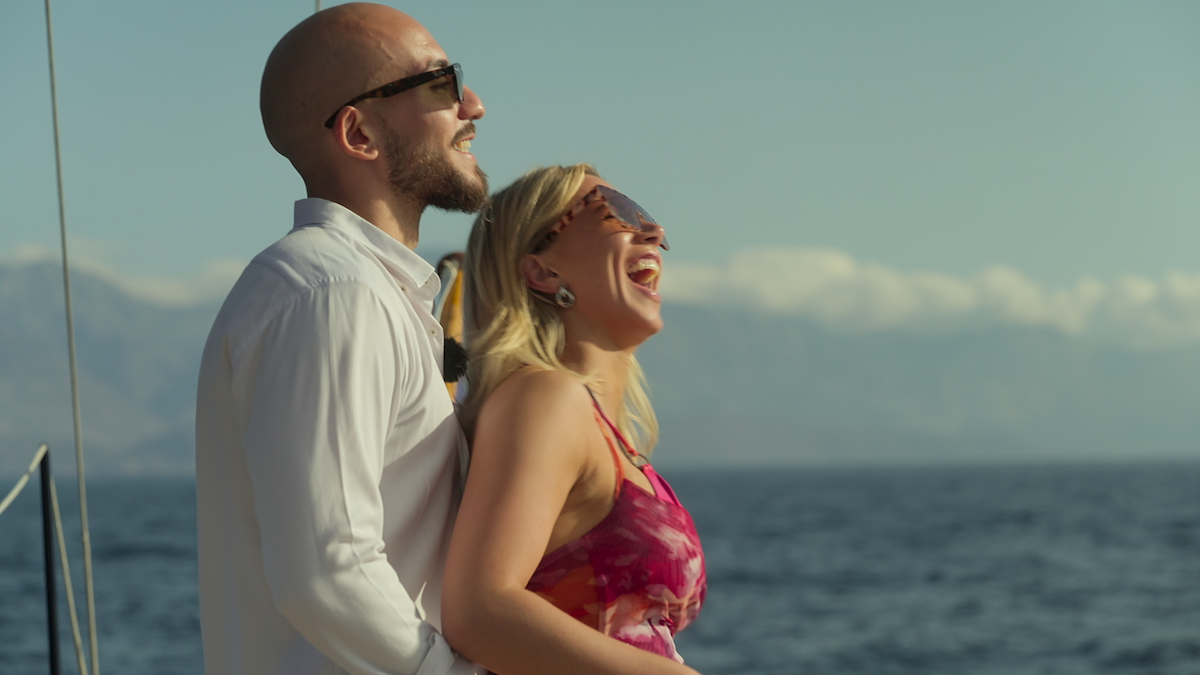 Hanni and Daniel look out on the ocean.