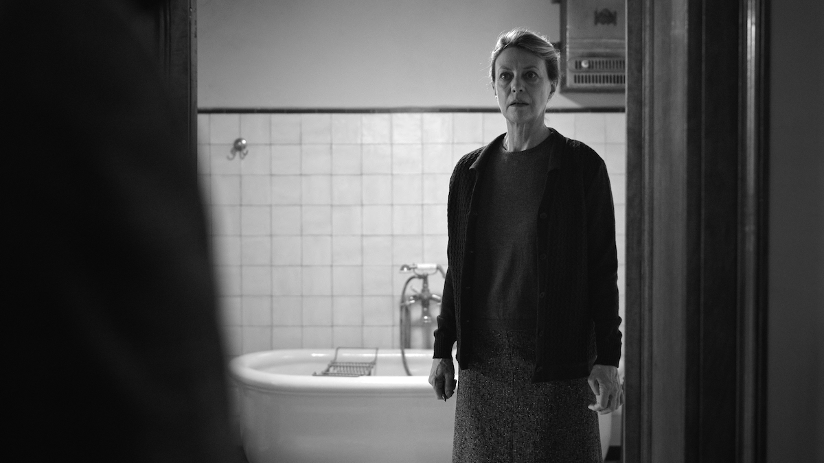 Margherita Buy as Signora Buffi stands in a bathroom with a fearful expression in ‘Ripley’