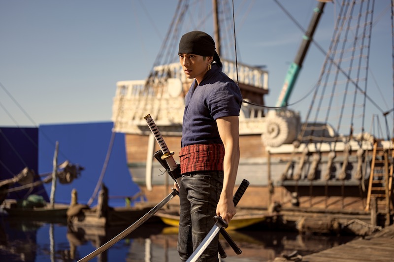Mackenyu as Roronoa Zoro stands on a pirate ship set in Season 1 of 'One Piece.'