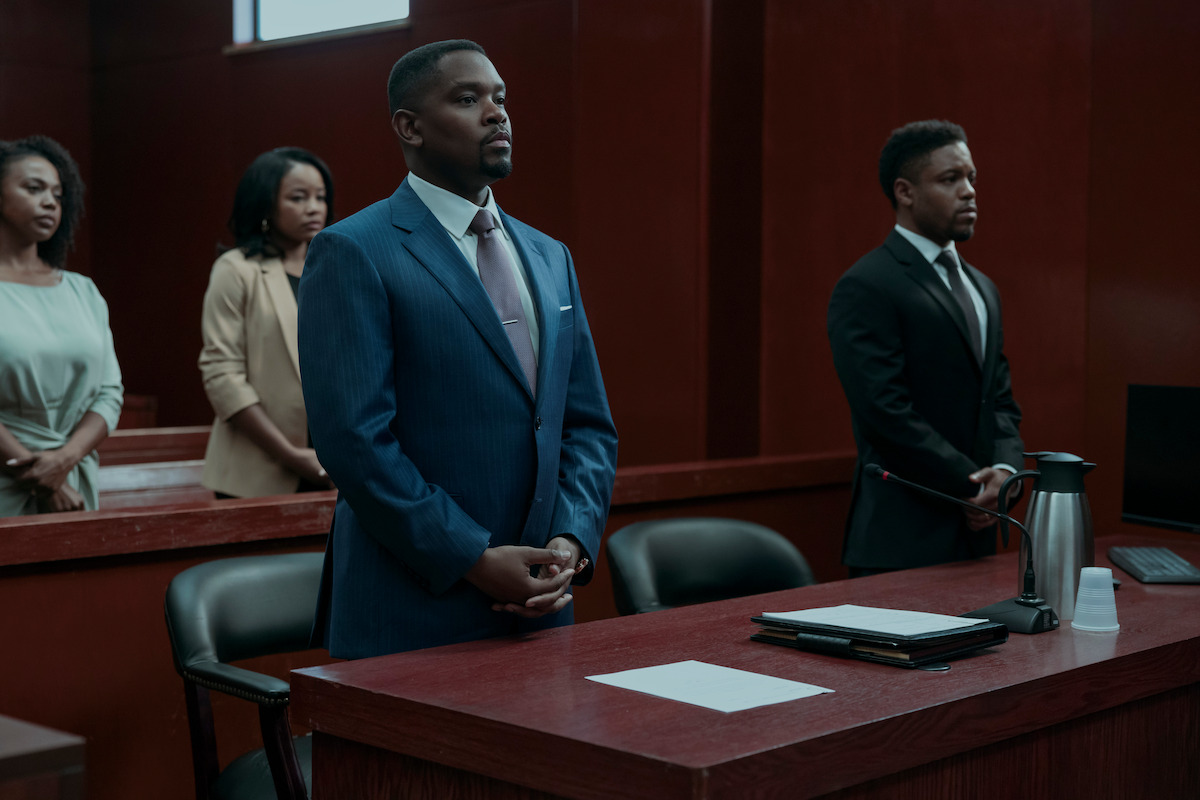 Aml Ameen as Roger White stands in a courtroom in ‘A Man in Full’