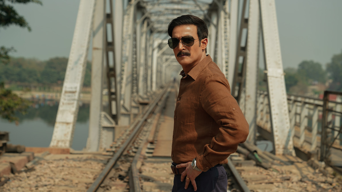 Jimmy Shergill as Montu stands on train tracks in front of a bridge with his hands on his hips in an image from the film ‘Phir Aayi Hasseen Dillruba.’