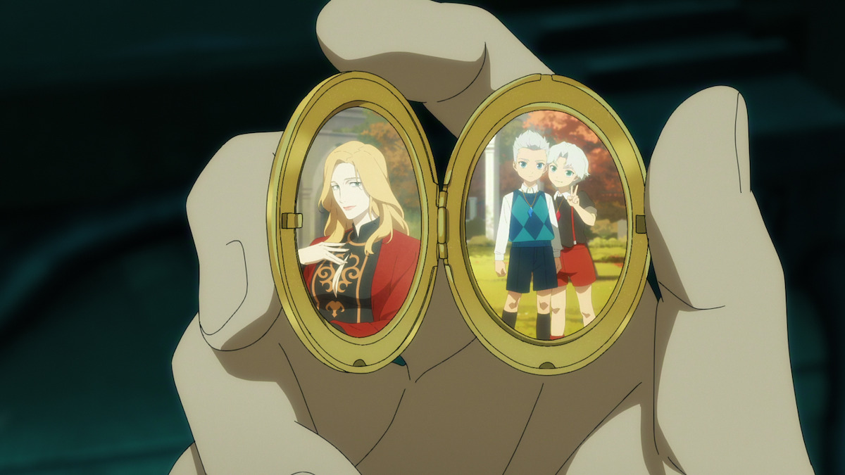 A hand holds an open locket with two photos inside: one of a smiling blonde woman in formal clothing, the other of two children standing together outdoors in an autumn setting.