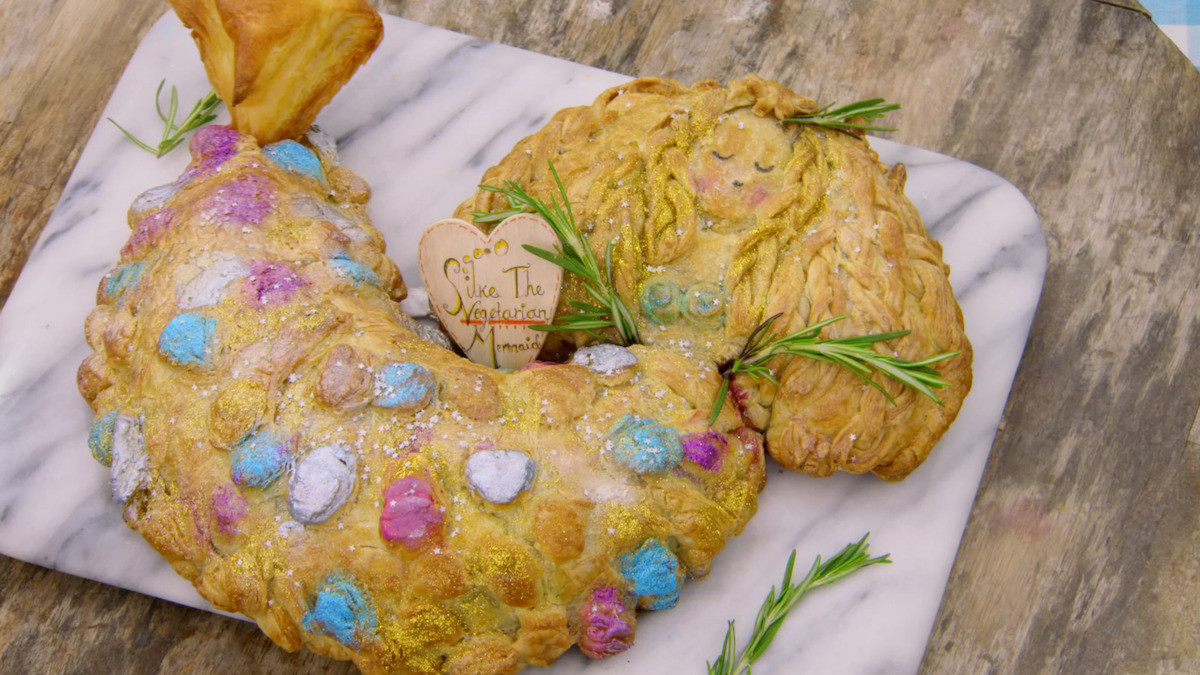 A vegetarian pie that is shaped in the form of a mermaid