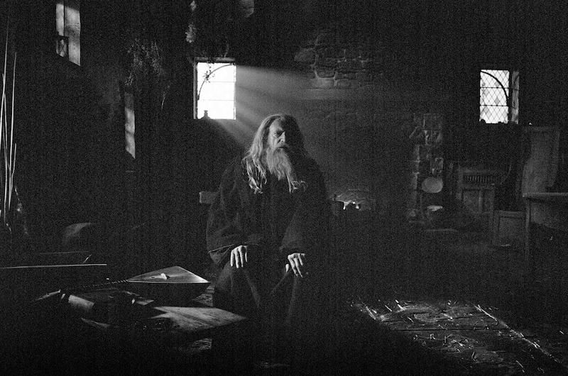 A black-and-white image of David Bradley in character as the Blind Man.