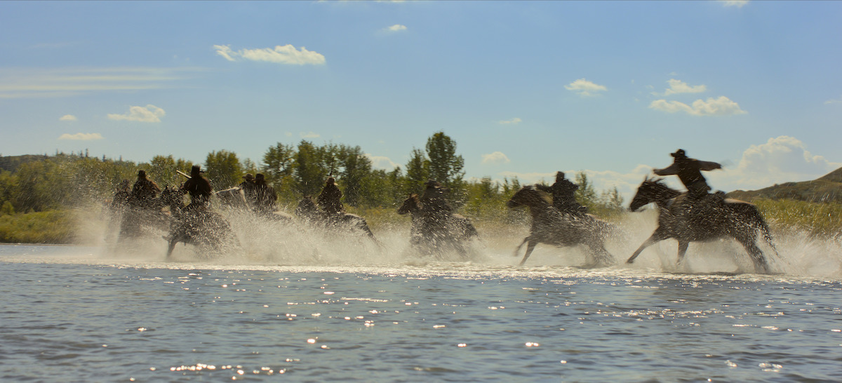 Horses run through a river in ‘The Abandons’