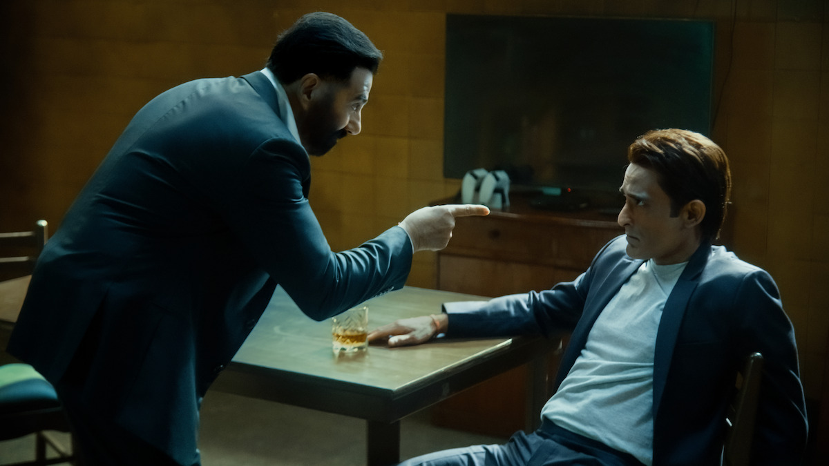 Sunny Deol as Arjun Mehra questions Akshaye Khanna as Shauryaman Gaur in a holding cell in ‘Ikka.’