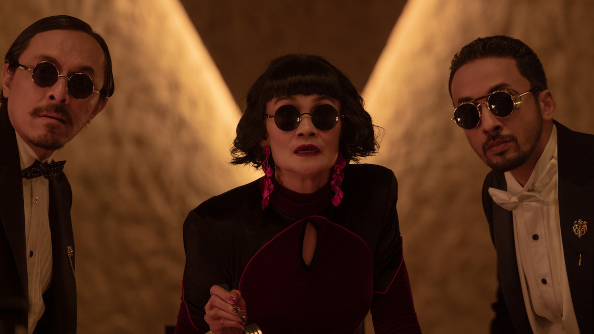 Agus Firmansyah as Mikail, Sarita Ibrahim as Sofia, and Haydar Salishz as Adrian look toward the camera wearing sunglasses in an image from the anthology series ‘Joko Anwar’s Nightmares and Daydreams.’