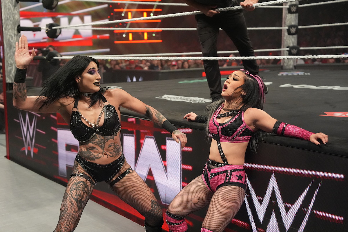 Rhea Ripley fights Roxanne Perez outside of the ring.