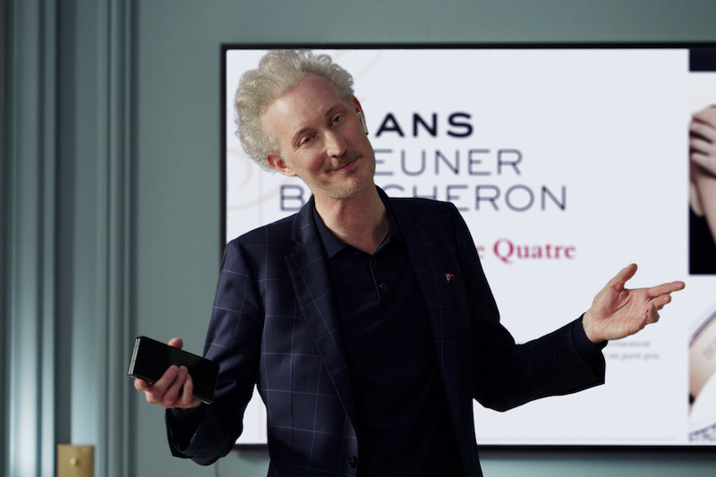 Bruno Gouery as Luc shrugs in Season 4 of 'Emily in Paris'