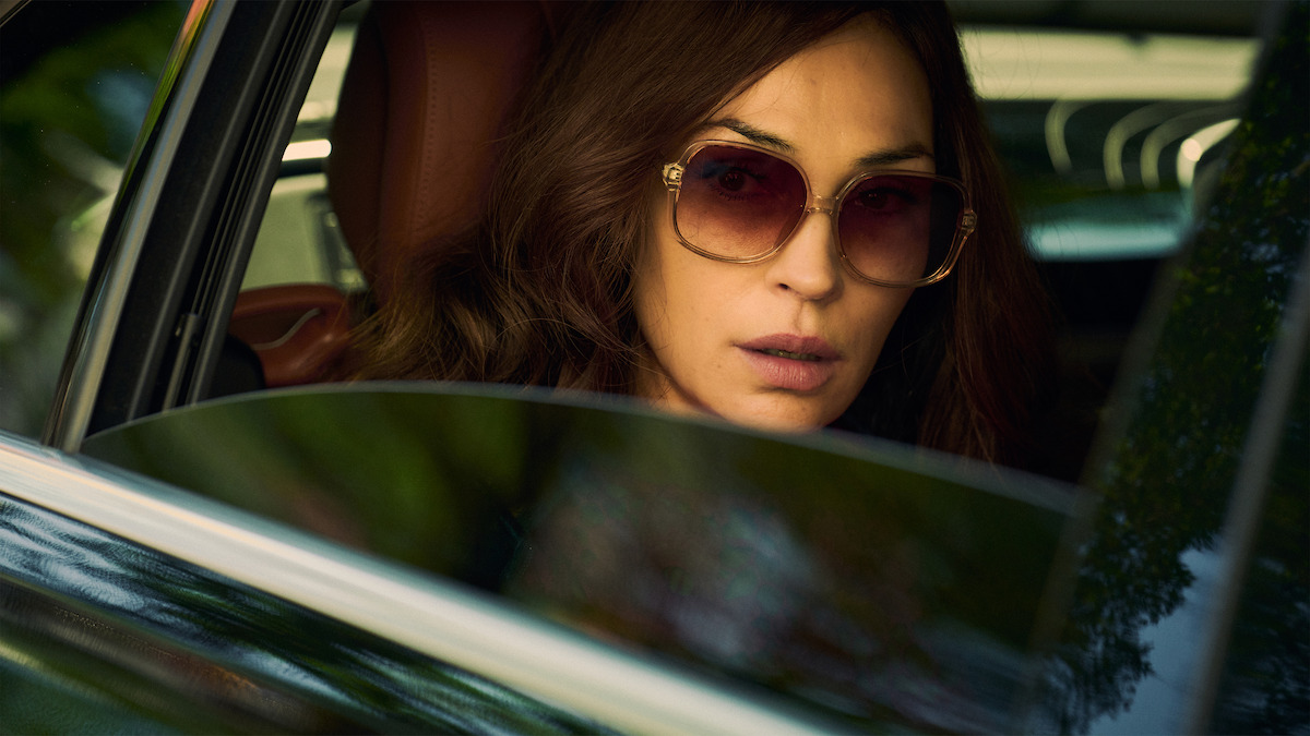 Famke Janssen as Betty gazes through a car window in 'Amsterdam Empire.'