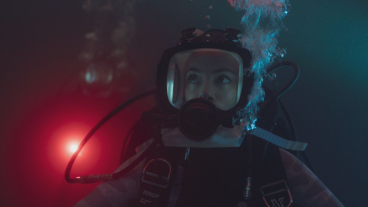 Bérénice Bejo as Sophia breaths underwater in an image from the film ‘Under Paris.’