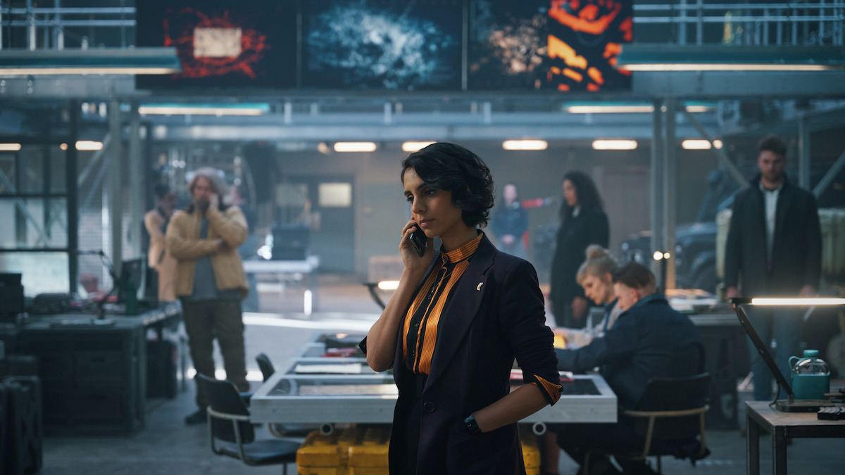 Anjli Mohindra as Archie takes an important call in an image from ‘The Lazarus Project.’