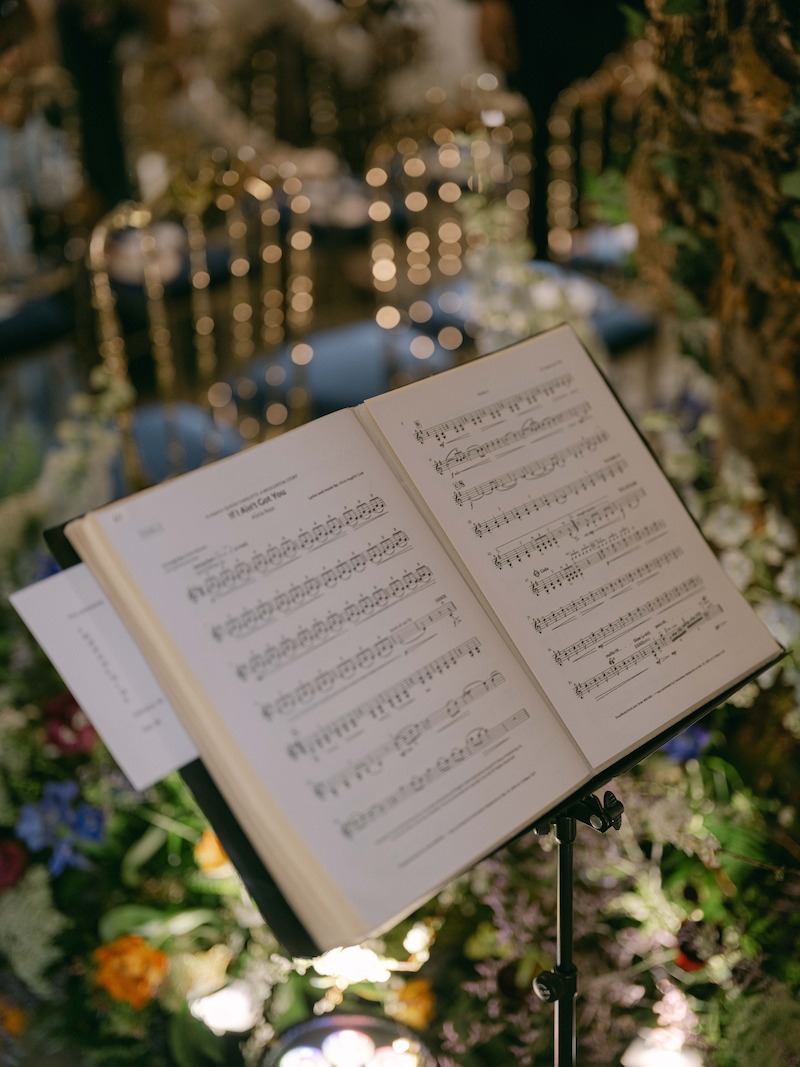 A music sheet lays open on a stand in 'The Event of the Season: A Bridgerton Wedding'