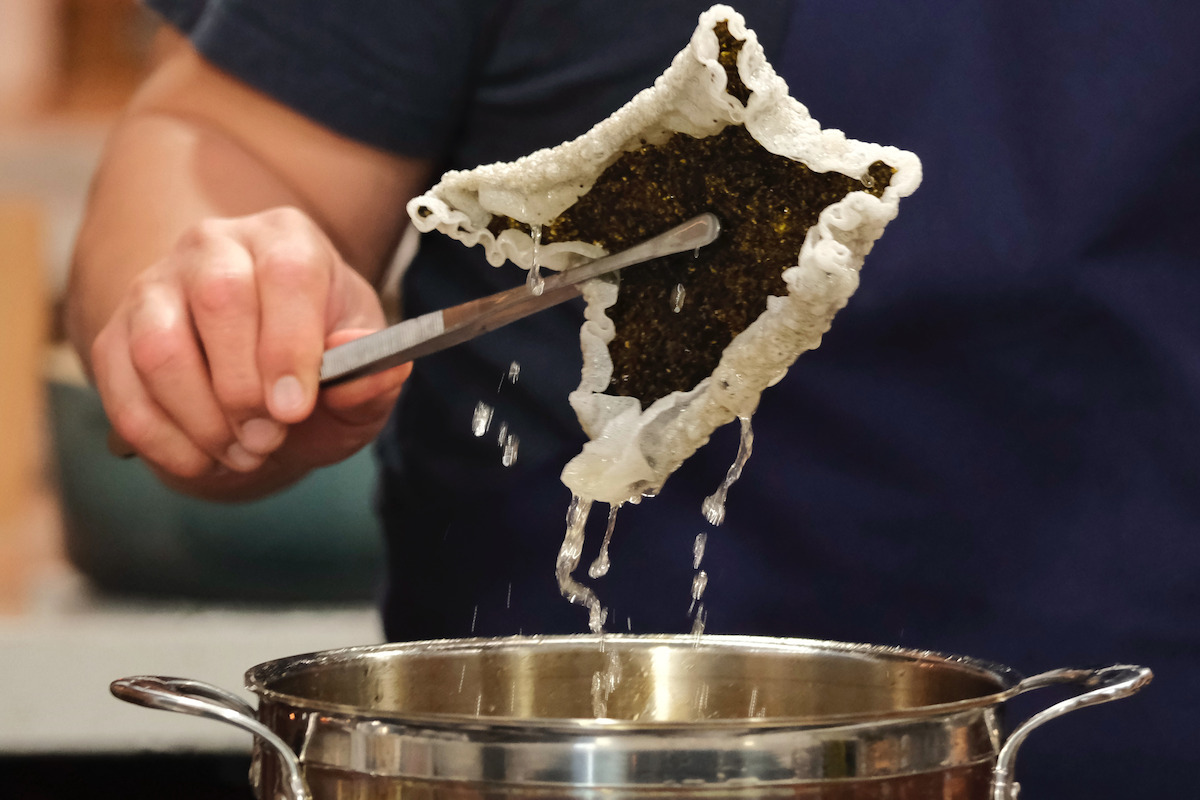 Seaweed Crisps being pulled out of a pot.