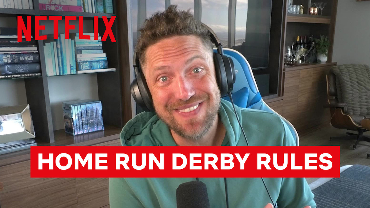 Smiling man with headphones sits in a modern home office, speaking into a microphone. Bookshelves, a chair, plants, and Netflix branding are visible. Text overlay reads "HOME RUN DERBY RULES."