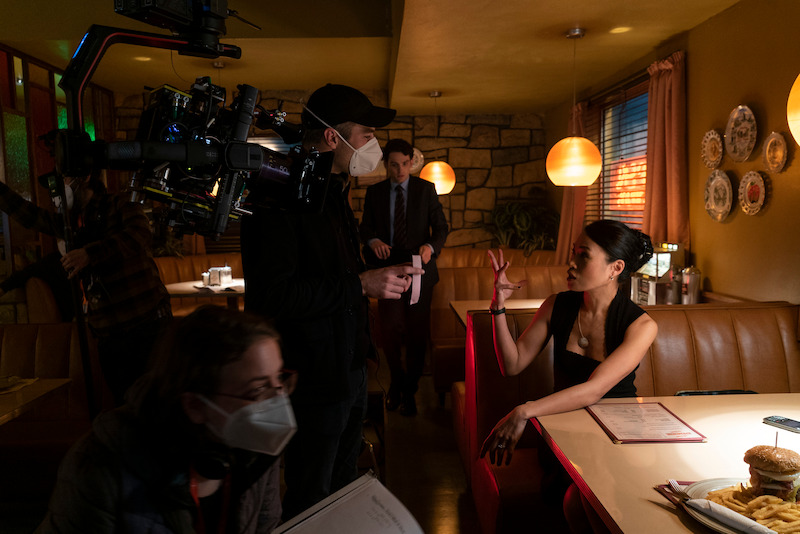 Kate (Lourdes Faberes) and director Jamie Childs talk through the diner scene.