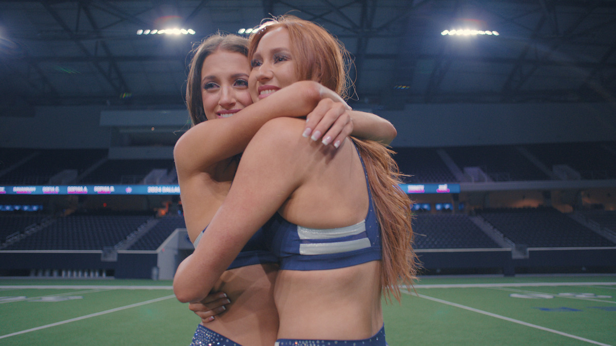 Charly and Kelly V embrace eachother as they make the team.