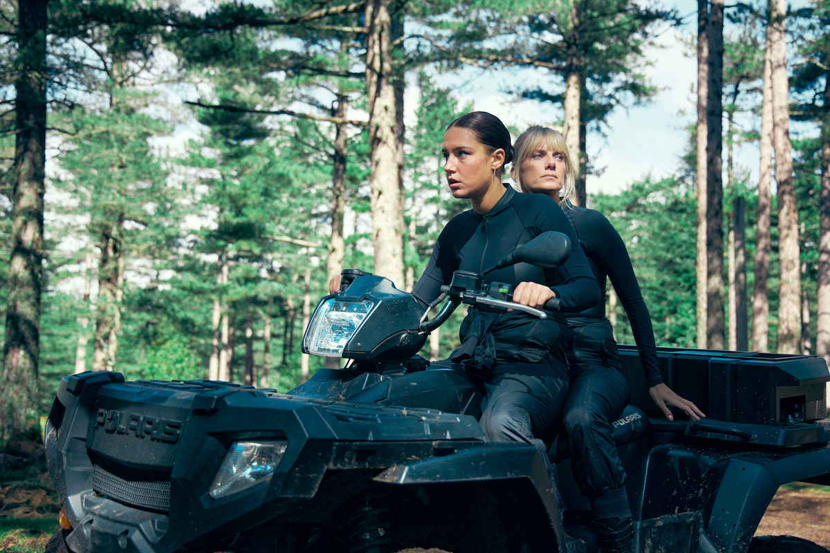 Mélanie Laurent and Adèle Exarchopoulos drive a four wheeler through a forest in ‘Wingwomen’